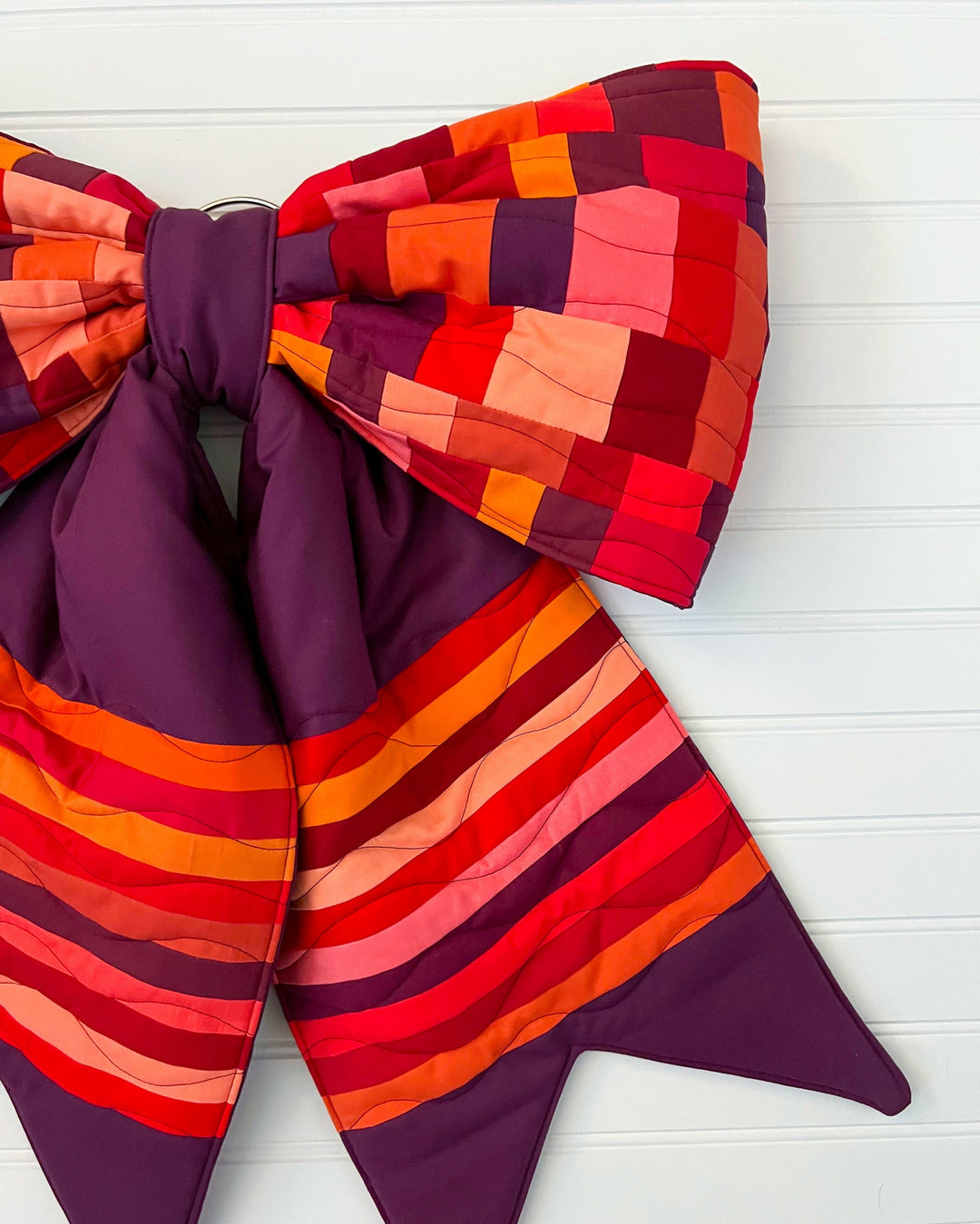 the big giant quilted bow made with red, orange and berry colored Confetti Cotton solids fabrics