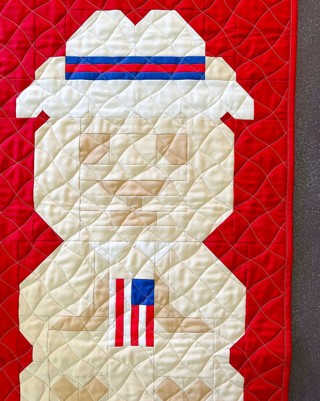 Ms Beary Rosslyn a bear quilt with patriotic spirit by holding an American Flag