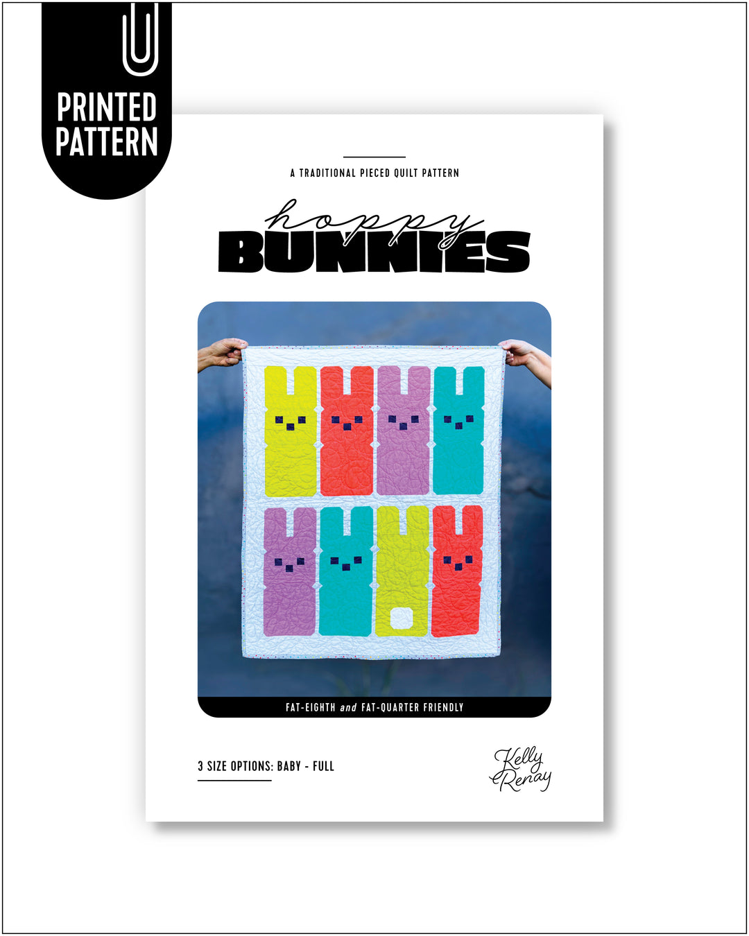 Quilt pattern book cover titled 'Hoppy Bunnies' with a colorful bunny quilt held against a dark gray wall